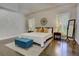 Bright main bedroom suite showcasing shuttered windows, tray ceiling, and stylish decor at 452 Brushstroke Se Ct, Marietta, GA 30067