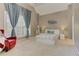 Spacious main bedroom featuring vaulted ceiling, large windows, and comfortable seating at 452 Brushstroke Se Ct, Marietta, GA 30067