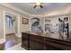 Office space with custom bookshelves, hardwood floors, an area rug, and a view into the home at 452 Brushstroke Se Ct, Marietta, GA 30067