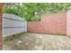 Private brick-walled patio offers a serene outdoor retreat at 452 Brushstroke Se Ct, Marietta, GA 30067