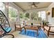 Relaxing screened porch with comfortable seating and views of the lush backyard at 452 Brushstroke Se Ct, Marietta, GA 30067