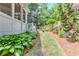 Scenic side yard featuring a well-manicured lawn and beautiful landscaping for outdoor enjoyment at 452 Brushstroke Se Ct, Marietta, GA 30067
