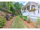 Lush side yard featuring a well-manicured lawn and beautiful landscaping for outdoor enjoyment at 452 Brushstroke Se Ct, Marietta, GA 30067