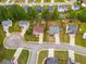 Aerial view of homes in a residential neighborhood, showcasing landscaping and street layout at 5069 Luxford Dr, Douglasville, GA 30135
