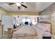 Bedroom featuring tray ceilings, desk and ample space, creating a luxurious and relaxing ambiance at 5069 Luxford Dr, Douglasville, GA 30135