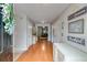 Bright entryway showcasing hardwood floors, fresh paint, and decorative accents at 5069 Luxford Dr, Douglasville, GA 30135