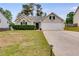 Charming single-Gathering home featuring a well-manicured lawn and an attached two-car garage at 5069 Luxford Dr, Douglasville, GA 30135