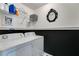 Well-organized laundry room with modern appliances and stylish decor at 5069 Luxford Dr, Douglasville, GA 30135