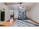 Cozy living room featuring hardwood floors, neutral paint, and an elegant ceiling fan at 5069 Luxford Dr, Douglasville, GA 30135
