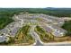 A Primary-planned community with winding roads, lush landscaping, and a central pond and amenity center at 52 Lantern Trce, Hiram, GA 30141
