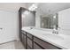 Sleek bathroom featuring a double vanity with stone countertop, modern fixtures, and ample storage at 52 Lantern Trce, Hiram, GA 30141