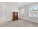 Bright bedroom featuring two large windows and wood floors at 52 Lantern Trce, Hiram, GA 30141