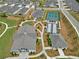 Aerial view of community clubhouse with tennis and bocce ball courts and parking at 52 Lantern Trce, Hiram, GA 30141