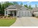 Charming one-story home with manicured lawn and cozy front porch seating at 52 Lantern Trce, Hiram, GA 30141