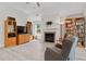 Inviting living room with a fireplace, shelving, and ample natural light creates a comfortable atmosphere at 52 Lantern Trce, Hiram, GA 30141