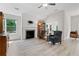 Bright living room featuring vaulted ceilings, wood floors, fireplace and a large window with natural light at 52 Lantern Trce, Hiram, GA 30141