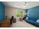 Inviting bedroom includes desk area, futon sofa, and a large window offering scenic views at 5626 River Heights Se Xing, Marietta, GA 30067