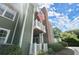 Exterior of condo features green siding and deck, showing the outdoor living spaces at 5626 River Heights Se Xing, Marietta, GA 30067