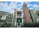 Charming condo exterior with private balconies, classic brick chimney, and neatly landscaped surroundings at 5626 River Heights Se Xing, Marietta, GA 30067