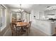 Open kitchen and dining area with a wooden dining table and chairs at 5626 River Heights Se Xing, Marietta, GA 30067