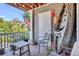 Comfortable front porch offering a relaxing outdoor space with chairs and beautiful natural view at 5626 River Heights Se Xing, Marietta, GA 30067
