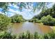 Picturesque water view with lush green trees lining the banks, creating a tranquil and inviting natural landscape at 5626 River Heights Se Xing, Marietta, GA 30067