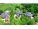 Aerial view of luxury homes on large lots with mature trees at 6515 Ashbourne Ct, Suwanee, GA 30024