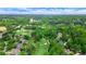 Beautiful aerial view of luxury homes on a golf course with lush green fairways and mature trees at 6515 Ashbourne Ct, Suwanee, GA 30024