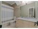 Bathroom featuring a vanity with granite countertop, toilet, and a shower with a curtain at 6515 Ashbourne Ct, Suwanee, GA 30024