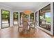Dining room featuring natural light, hardwood floors, and views of the outdoors at 6515 Ashbourne Ct, Suwanee, GA 30024