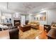 Inviting living room with a cozy fireplace, comfortable seating, and elegant decor at 6515 Ashbourne Ct, Suwanee, GA 30024