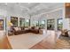 Large living room boasts coffered ceilings, hardwood floors, and patio access at 6515 Ashbourne Ct, Suwanee, GA 30024