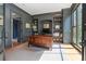 Comfortable home office with custom built-ins, a large desk, and natural light perfect for remote work at 6515 Ashbourne Ct, Suwanee, GA 30024