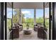 Inviting outdoor patio with comfortable seating around a stone table, perfect for relaxing and enjoying the view at 6515 Ashbourne Ct, Suwanee, GA 30024