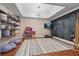 Charming playroom features ample storage, chalkboard wall, and natural light at 6515 Ashbourne Ct, Suwanee, GA 30024