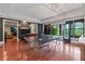 Spacious recreation room featuring a ping pong table, foosball table, and natural light from the patio at 6515 Ashbourne Ct, Suwanee, GA 30024