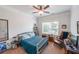 Cozy bedroom with a ceiling fan, natural light, and comfortable furnishings for a relaxing retreat at 17 Lexington Ct, Dallas, GA 30157