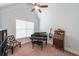 Versatile bonus room with a high ceiling, piano, natural light, and great space for hobbies at 17 Lexington Ct, Dallas, GA 30157