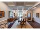 Elegant dining room featuring a coffered ceiling, hardwood floors, and a view of the front yard at 17 Lexington Ct, Dallas, GA 30157