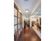 Elegant entryway with gleaming hardwood floors and views into the dining, living room and kitchen at 17 Lexington Ct, Dallas, GA 30157