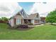 Charming single-Gathering home featuring stone accents, a well-manicured lawn, and a cozy, inviting entrance at 17 Lexington Ct, Dallas, GA 30157