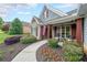 Inviting front porch featuring stone accents and a charming walkway surrounded by lush landscaping at 17 Lexington Ct, Dallas, GA 30157
