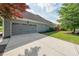This home has a two car garage with an extra wide driveway and manicured side yard at 17 Lexington Ct, Dallas, GA 30157