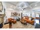 Bright open living room with coffered ceilings, fireplace, and seamless flow into the modern kitchen at 17 Lexington Ct, Dallas, GA 30157