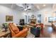 Inviting living room featuring a stone fireplace, coffered ceiling, hardwood floors, and an open layout at 17 Lexington Ct, Dallas, GA 30157