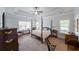 Main bedroom with trey ceilings, a four-poster bed and lots of natural light at 17 Lexington Ct, Dallas, GA 30157