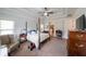 Main bedroom with trey ceilings, a four-poster bed and lots of natural light at 17 Lexington Ct, Dallas, GA 30157