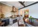 Outdoor kitchen featuring a stainless grill, brick walls and barrel table at 17 Lexington Ct, Dallas, GA 30157