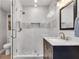 Updated bathroom with a marble-tiled shower and glass door, complemented by a modern vanity at 175 15Th Ne St # 304, Atlanta, GA 30309