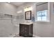 Modern bathroom featuring a tiled walk-in shower, contemporary vanity, and a stylish mirror at 175 15Th Ne St # 304, Atlanta, GA 30309